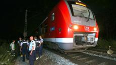 Police officers stand by a regional train in Wuerzburg southern Germany on July 18, 2016 after a man attacked train passengers with an axe. German police killed the man after he attacked passengers on a train with an axe and a knife, seriously wounding three people, news agency DPA reported citing police. / AFP / dpa / Karl-Josef Hildenbrand / Germany OUT (Photo credit should read KARL-JOSEF HILDENBRAND/AFP/Getty Images)