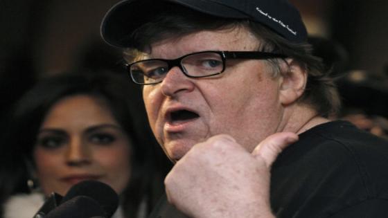 Documentary filmmaker Michael Moore gestures while being interviewed at "Oscar Celebrates: Docs," featuring this year's Oscar-nominated films in the Documentary Short Subject and Documentary Feature categories at the Academy of Motion Picture Arts and Sciences in Beverly Hills, California, February 20, 2013. REUTERS/Jonathan Alcorn (UNITED STATES - Tags: ENTERTAINMENT)