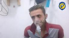 A still image taken on August 2, 2016 from a video said to be taken on August 1, 2016 posted on social media shows a man sitting breathing through a mask in what is said to be in Saraqeb, Idlib province, Syria. Social Media/Handout via Reuters Tv