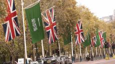 Flags of the United Kingdom and Saudi Arabia line the Mall in central London, 29 October 2007, as Britain prepares to welcome King Abdullah of Saudi Arabia later Monday. The king, the first Saudi monarch in 20 years to visit Britain, will be met by heir to the throne Prince Charles and will stay at Buckingham Palace, Queen Elizabeth II's home in the capital. His visit has already stirred up criticism from politicians and protestors who allege human rights abuses and corruption in Saudi Arabia. AFP PHOTO/SHAUN CURRY (Photo credit should read SHAUN CURRY/AFP/Getty Images)