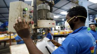 A machine operator pumps insulating foam into a portable cooler at Decorplast, a manufacturer and regional exporter of injection-moulded plastic goods. As a result of being able to use machinery and a quarterly list of stocks as collateral, through the use of a collateral registry, the company was able to secure financing from CAL Bank at more competitive rates than previously available. According to company director Indru Mahbubani, as of 2014 the company had assets of over USD 30 million (GBP 17,781,632), and debts of a little less than USD 5 million (GBP 2,963,605), which they hoped to settle in full after concluding a property sale in the course of 2014. International Finance Corporation (IFC) supported initiatives to create a regulatory framework for leasing and establish credit bureaus and collateral registries have improved access to finance for Small and Medium Enterprises (SMEs). *** Local Caption *** africa finance economics labour manufacturing factories developpement economique